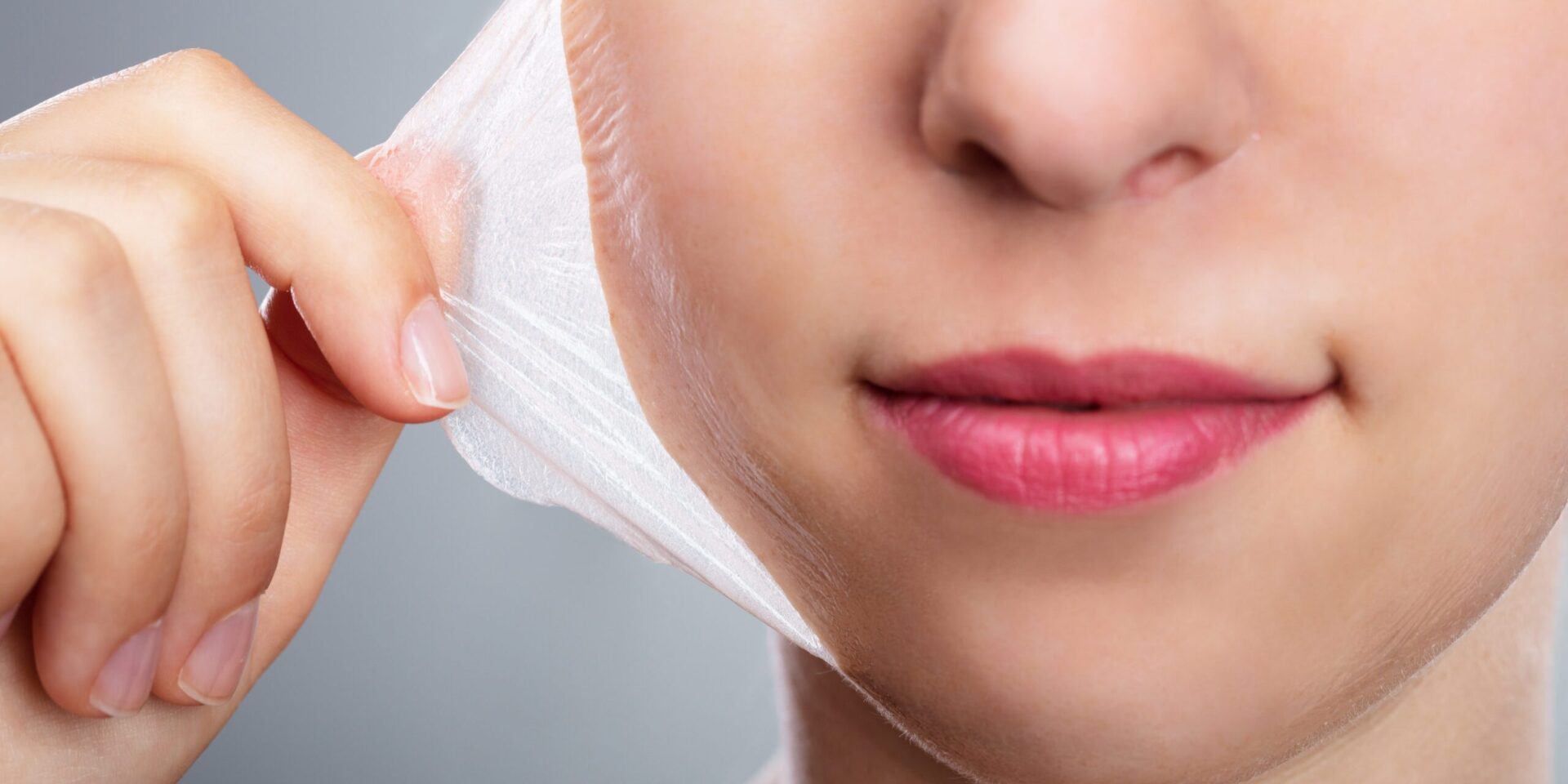 Close-up of facial mask removal