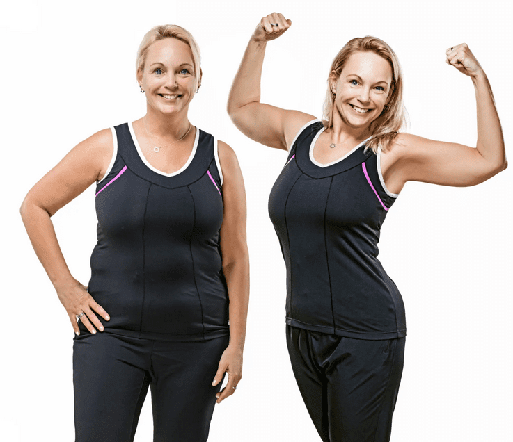 Two fit women in black workout clothes smiling and flexing muscles.