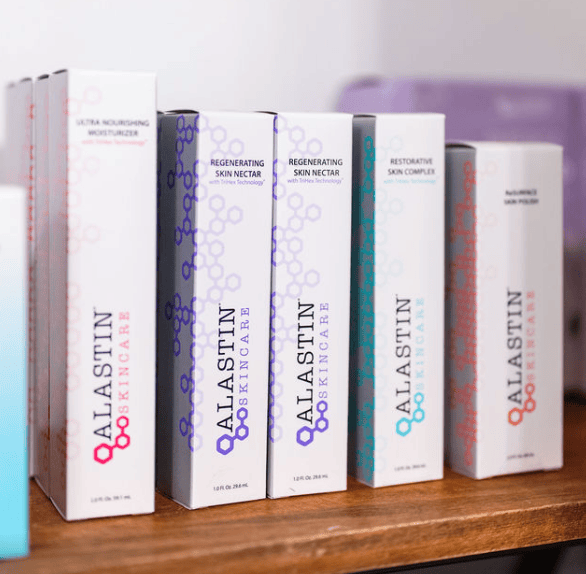 Alastin Skincare product boxes on wooden shelf